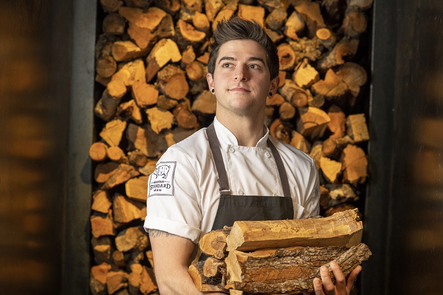 chef carrying firewood