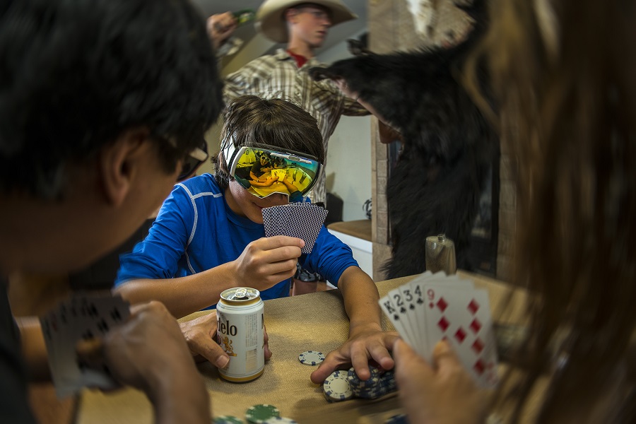 kid with goggles playing poker